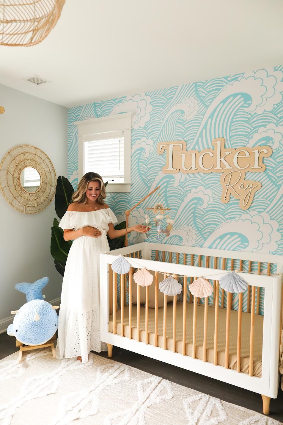 The Tucker Ray layered personalized wood name sign in a coastal nursery